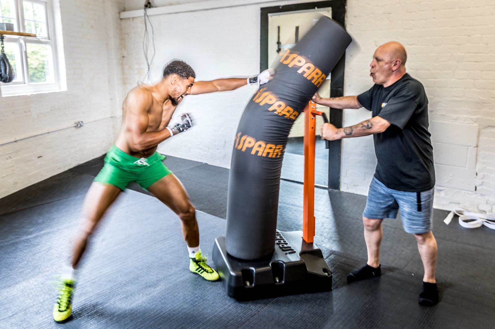 Joe Heaney, founder of iSPARR, training a boxer on the iSPARR bag